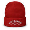 A red dirty dangles knit hockey beanie on a white background. Dirty Dangles hockey co.