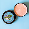 A tin of Dirty Dangles Hockey Stick Wax Grandma's Cookies scent sits open on a blue background.
