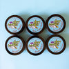 All 6 Dirty Dangles Hockey Wax scents sit on a blue background