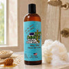 Bottle of Dirty Dancer body wash with honey and a sponge on a bathroom counter.