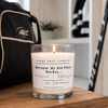 A white scented hockey candle on a wooden bench with hockey gear. Because my kid plays hockey.... 