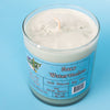A green dirty dangles natural hockey candle sour watermelon scent on a blue background