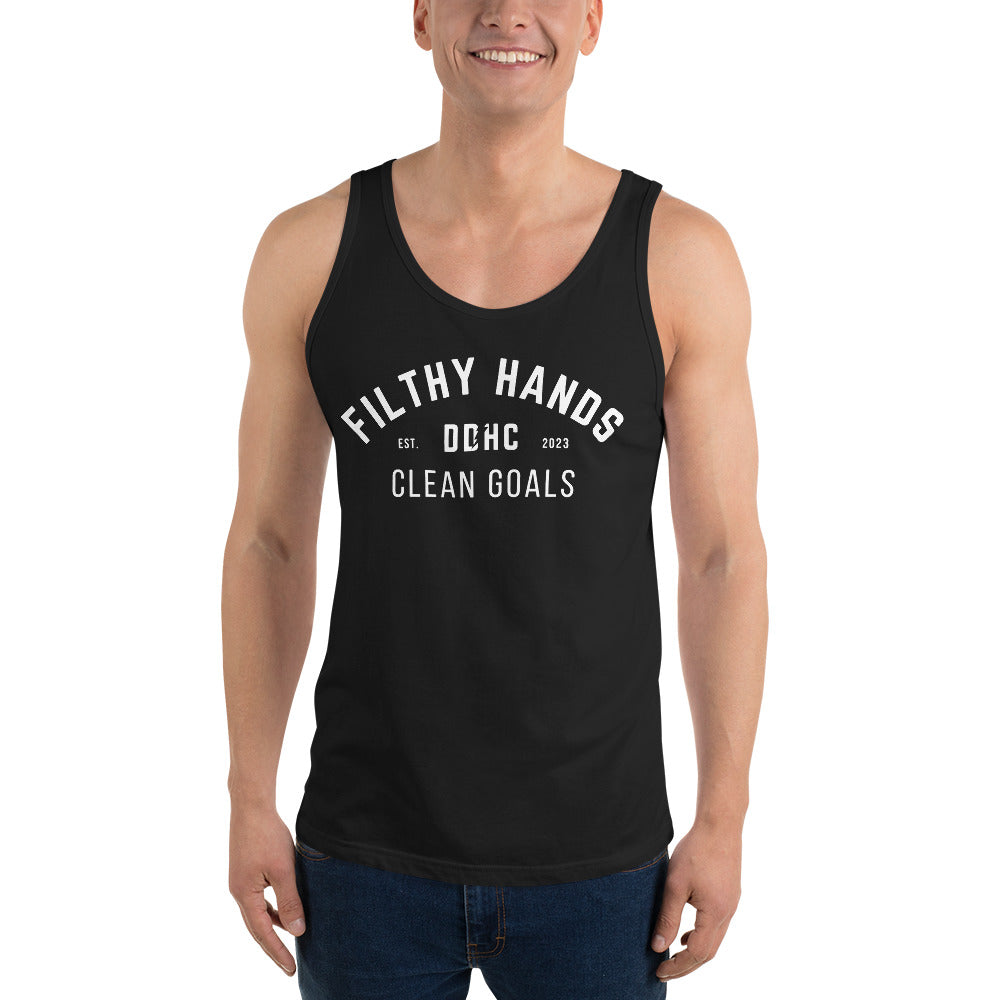 a man wearing a black filthy hands clean goals mens dirty dangles hockey tank top on a white background