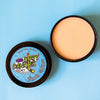 Fresh churro scented  Hockey Stick wax open on a blue background showing a tan stick wax.