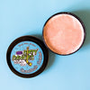 A tin of Dirty Dangles Hockey Stick Wax Grandma's Cookies Scent sits open on a blue background showing a tan stick wax.