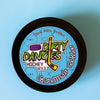 A tin of Dirty Dangles Hockey Stick Wax Grandma's Cookies scent sits on a blue background.