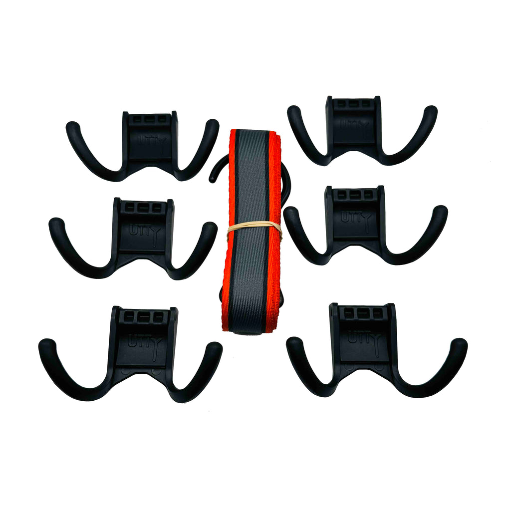 A picture of a disassembled Utty portable hockey gear drying rack on a white background