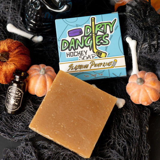 a box of dirty dangles slashing pumpkins pumpkin spice soap bars on a spooky halloween background