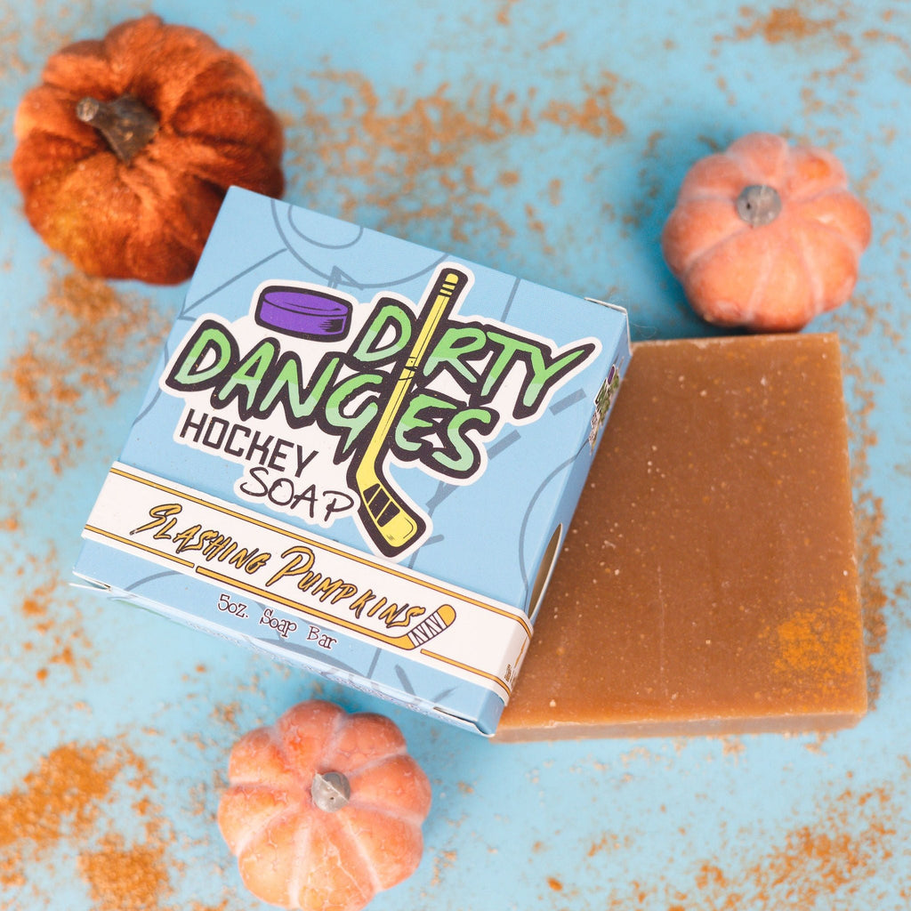a box of dirty dangles slashing pumpkins pumpkin spice soap bars on cinnamon and pumpkin background