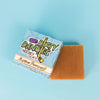 a box of dirty dangles slashing pumpkins pumpkin spice soap bars on a blue background