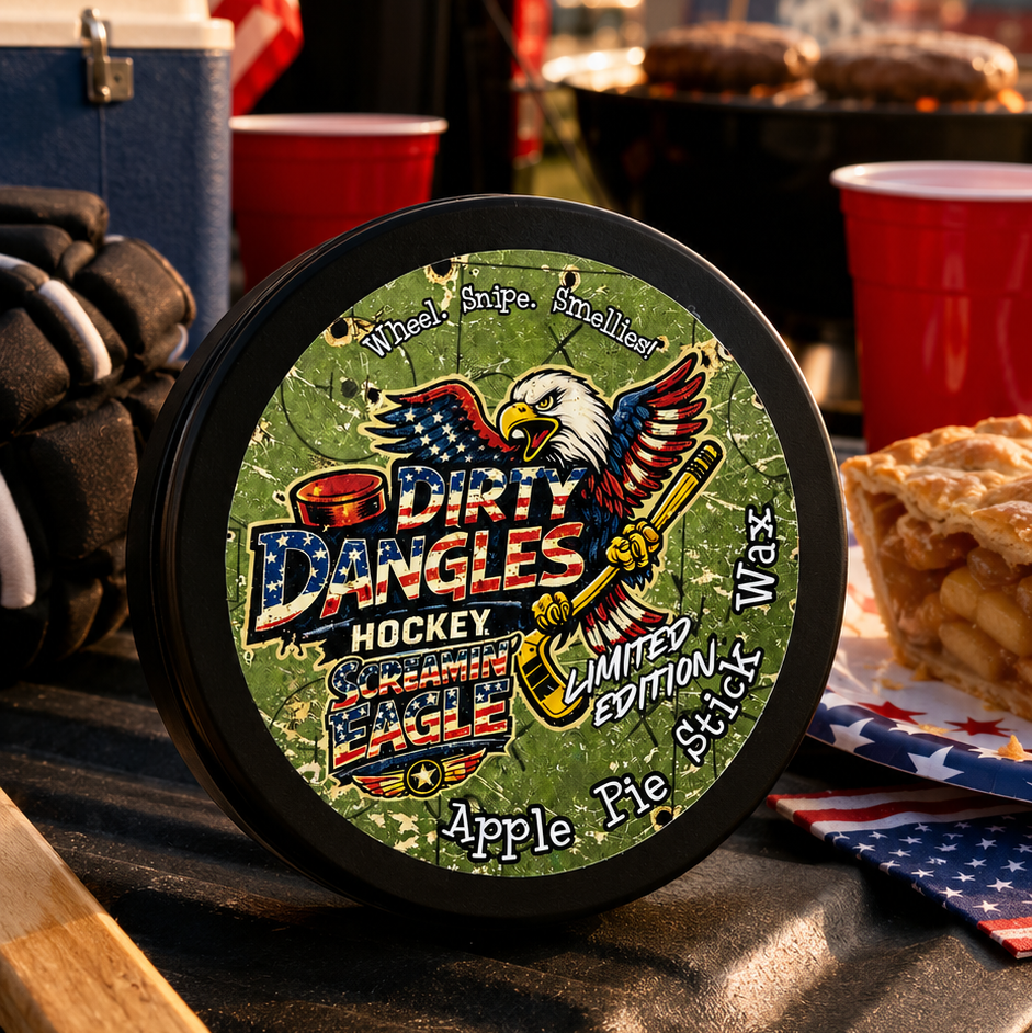 A tin of dirty dangles screamin eagle 4th of july stick wax on a truck tailgate with apple pie and american flags