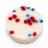Dirty dangles screamin eagle 4th of july stick wax on a white background showing red and blue dots in the wax