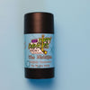 A tube of dirty dangles aluminum-free natural probiotic deodorant on a blue background. The Michigan scent
