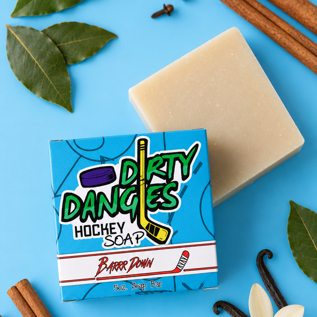 Barrr down bay rum scented hockey soap bar on a blue background with cinnamon, vanilla and bay leaves.