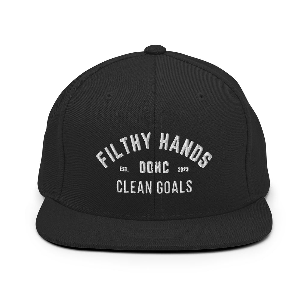 A black flat brim hat on white background.. Filthy hands clean goals