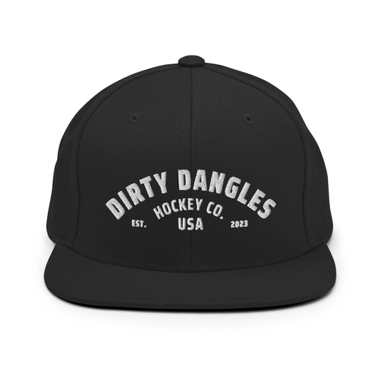 A black flat brim hat on white background. Dirty dangles hockey co.