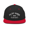 A black and red flat brim hat on white background.. Filthy hands clean goals