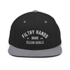 A black and gray flat brim hat on white background.. Filthy hands clean goals
