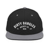 A black and gray flat brim hat on white background. Dirty dangles hockey co.