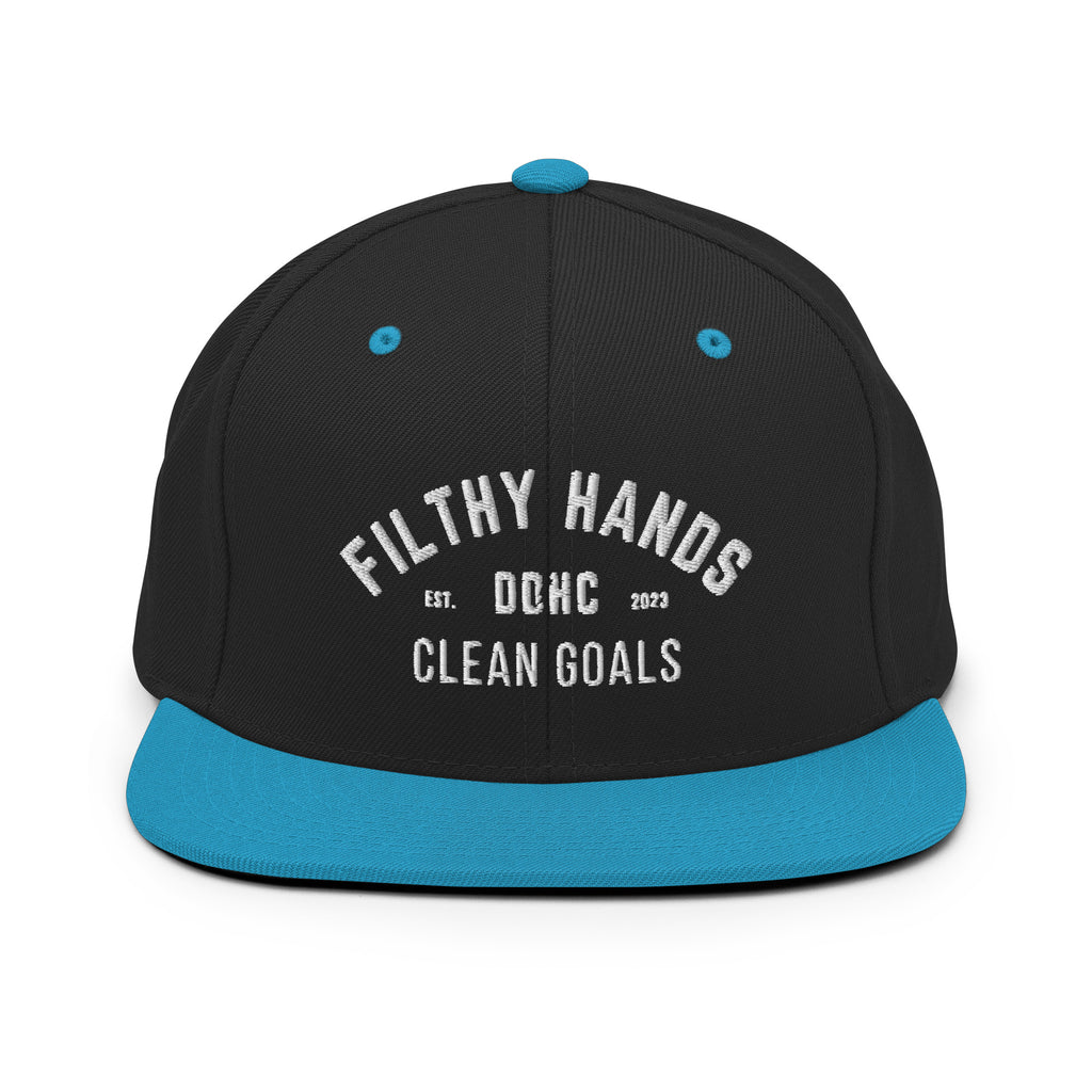 A black and neon blue flat brim hat on white background.. Filthy hands clean goals