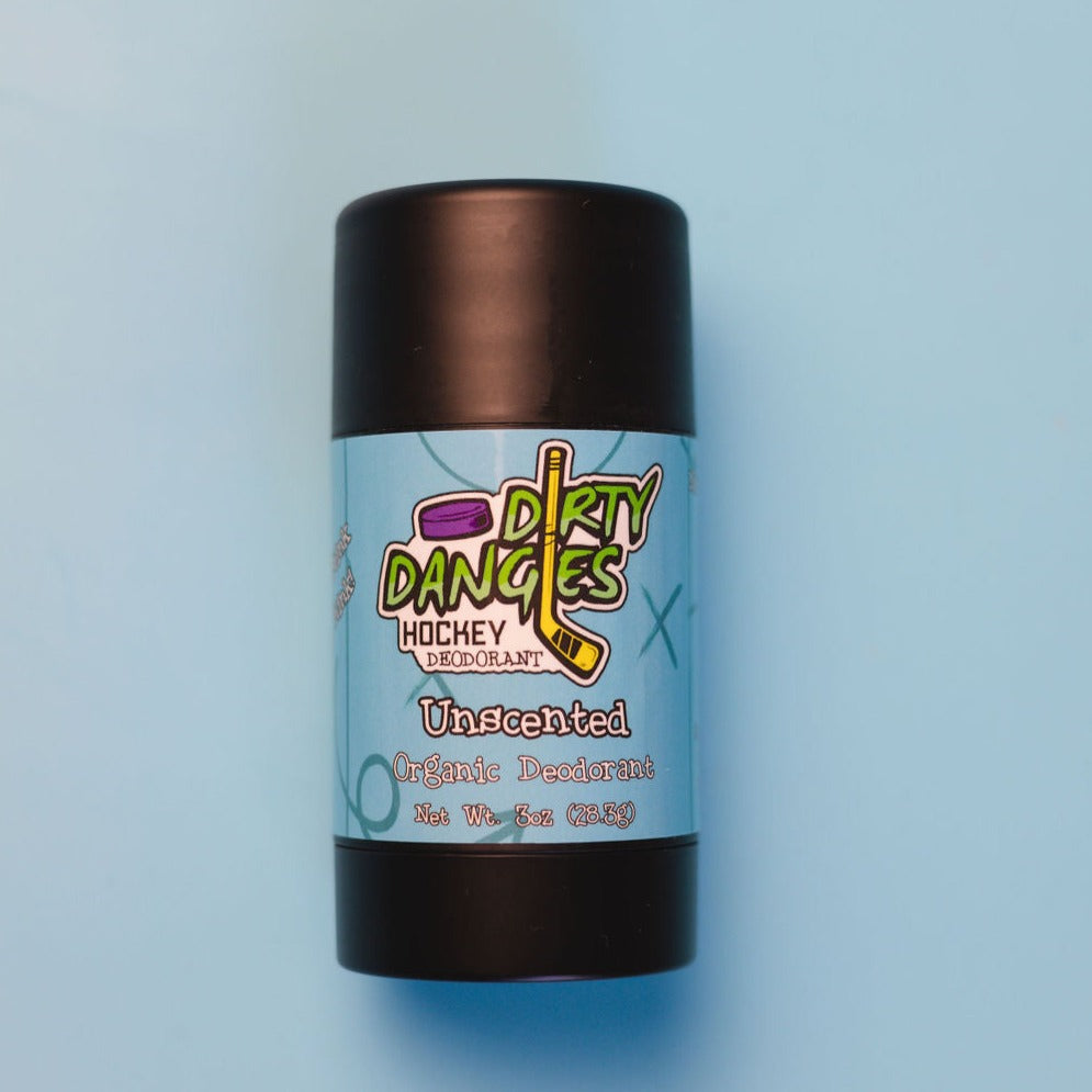 A tube of dirty dangles fragrance-free aluminum-free natural probiotic deodorant on a blue background. Unscented scent.