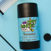 A tube of dirty dangles fragrance free aluminum-free unscented natural hockey deodorant on a blue background with hockey toys