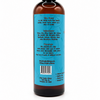 A dark amber bottle with a black cap, showing the back label of dirty dangles puck drop scented body wash. The label is bright blue with black text, and the bottle is photographed on a clean white background.