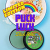 puck luck limited edition st patricks day hockey stick wax on a blue background with a bowl of lucky marshmallow cereal. Limited edition puck luck stick wax.