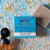 a brown silky mitts oatmeal milk and honey hockey soap bar on a blue background with honey and oats