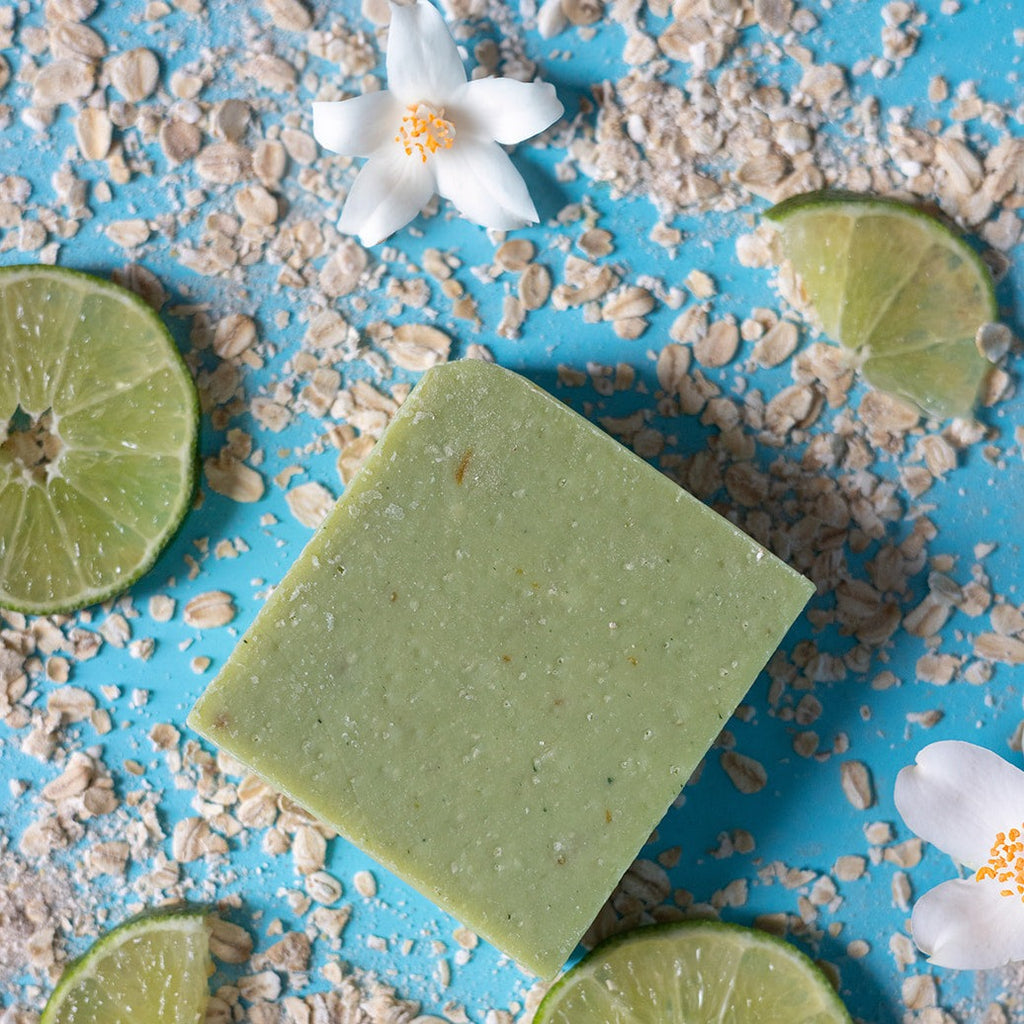tendies only green jasmine lime hockey goalie soap on a blue background with limes, jasmine flowers and oatmeal