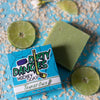 tendies only green jasmine lime hockey goalie soap on a blue background with limes, jasmine flowers and oatmeal