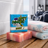 a bar of tiki deke tropical coconut girls hockey soap inside a clean hockey locker room with a pink white and blue beach towel.