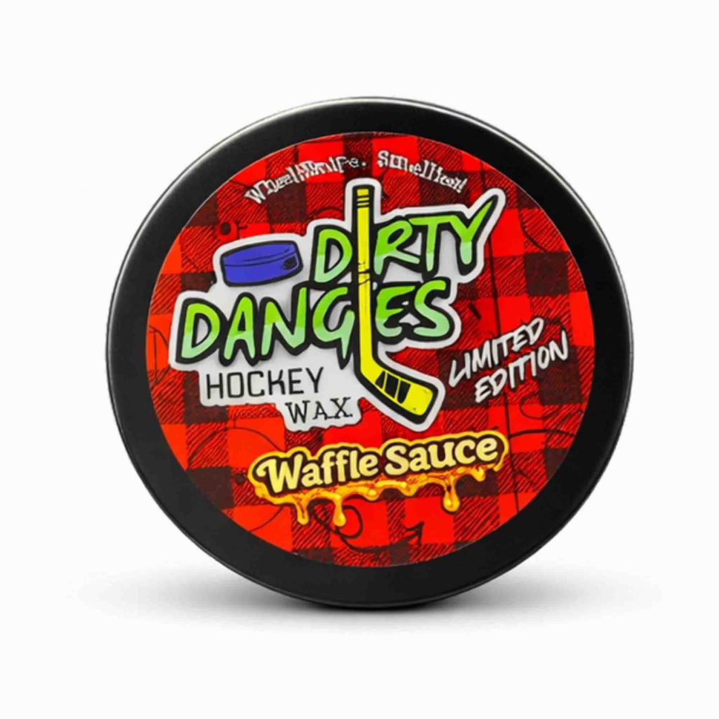 Container of Dirty Dangles hockey wax with a red and black checkered design on a white background