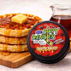 Container of 'Dirty Dangles' hockey wax Waffle Sauce Scent with a stack of waffles and syrup on a wooden board.