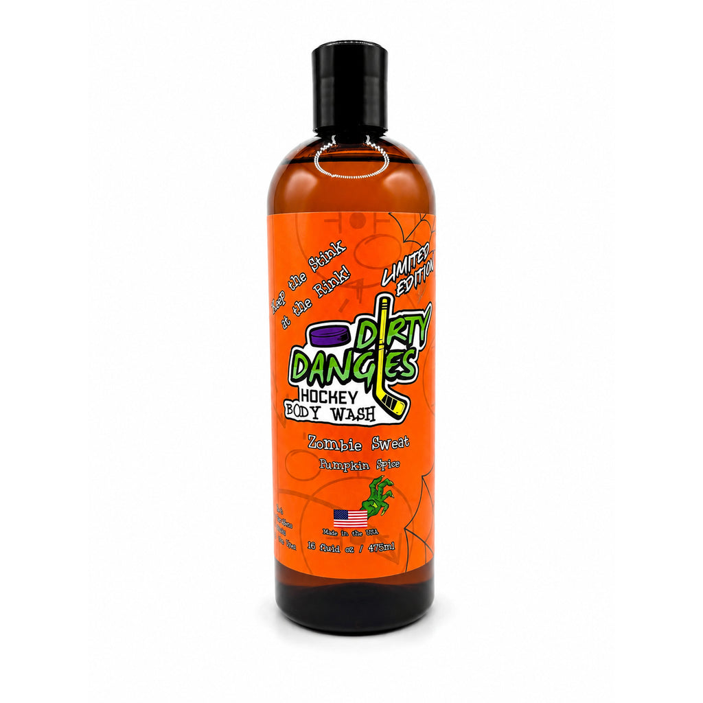 A bottle of Dirty Dangles Hockey Body Wash in Zombie Sweat Pumpkin Spice scent, featuring an orange label with green and purple text and graphics, on a white background.