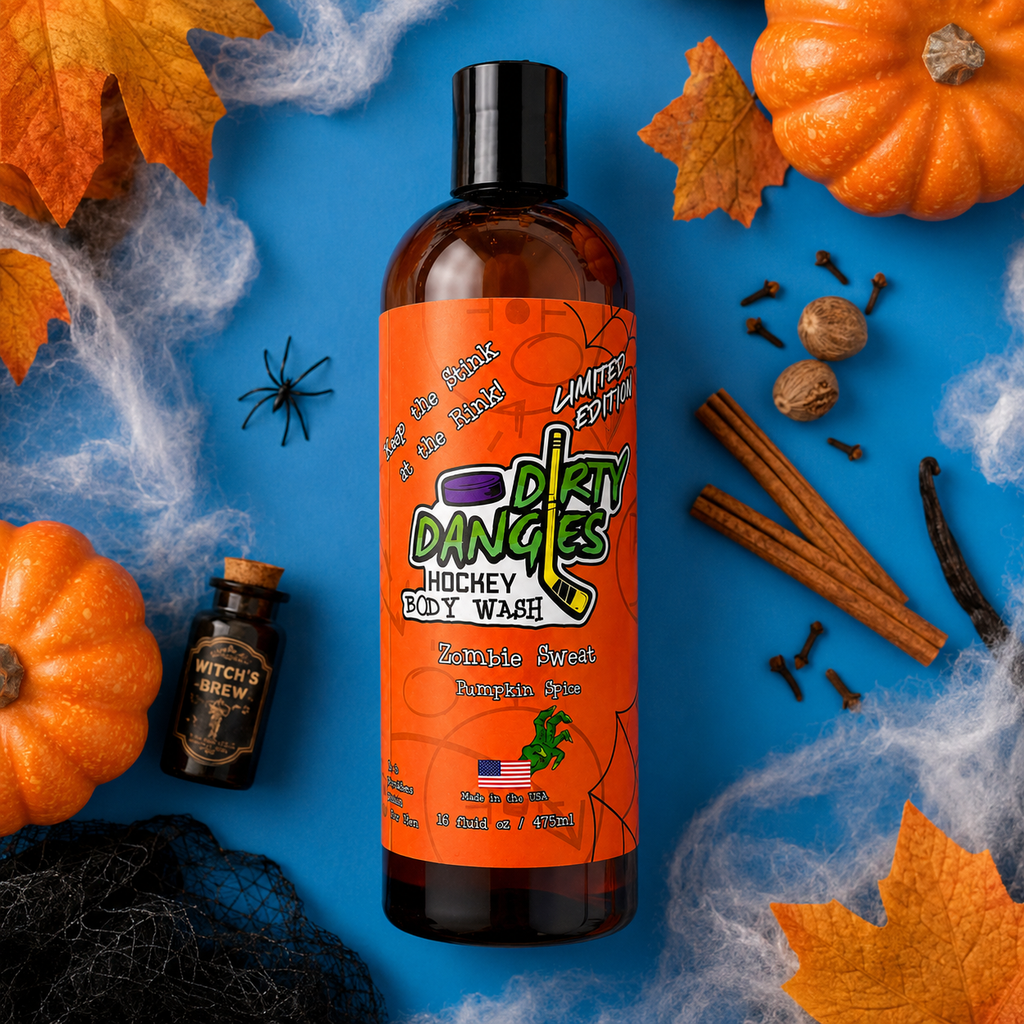 a bottle of zombie sweat halloween pumpkin spice hockey body wash on a blue background with pumpkins, spices, spider webs and autumn leaves.