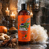 A bottle of Dirty Dangles Hockey body Wash in Limited Edition Zombie Sweat Pumpkin Spice scent in a spooky Halloween shower with candles, a loofah, ginger, and spices.