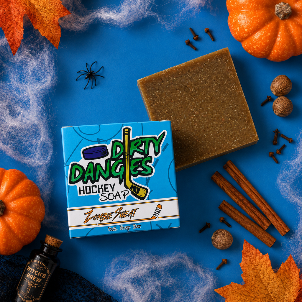 zombie sweat pumpkin spice scented hockey soap bar on a blue background with spices, spiderwebs and fall decor