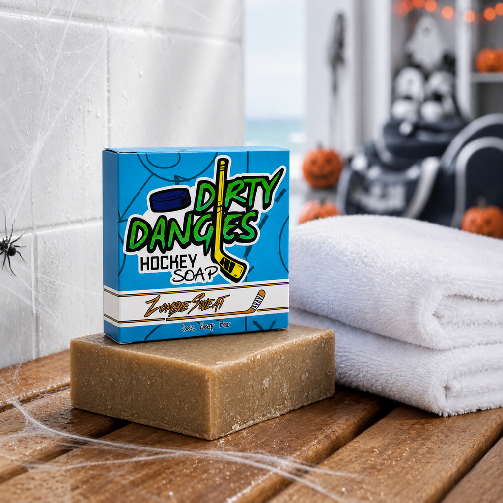 zombie sweat pumpkin spice scented hockey soap bar in the snow with a hockey stick, goal and halloween decor