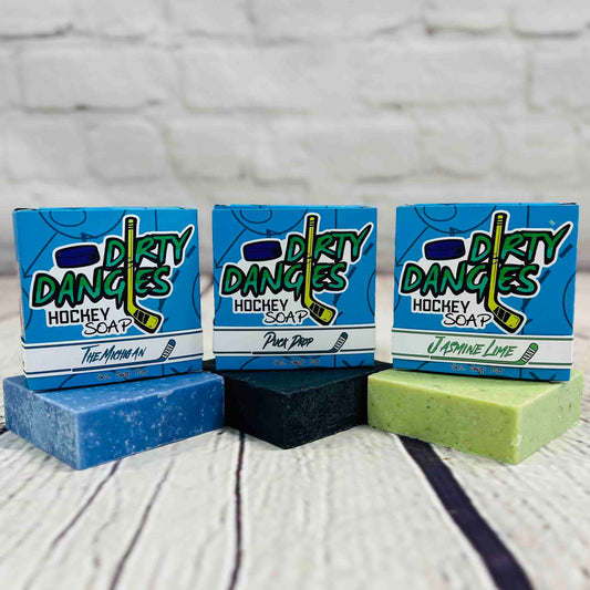 Top shelf bundle. 3 soap bars on a wood background. The michigan, puck drop and jasmine lime scents. Dirty dangles hockey.